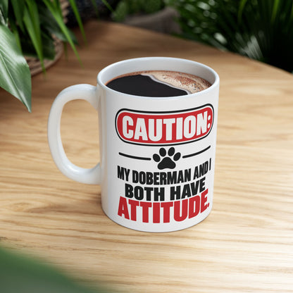 Caution My Doberman And I Both Have Attitude Ceramic Coffee Mug