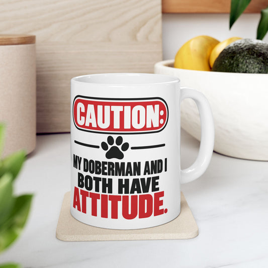 Caution My Doberman And I Both Have Attitude Ceramic Coffee Mug